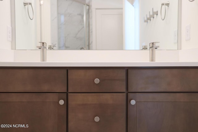 235 Weathersbee Dr, Hampstead, NC 28443 - full bathroom with double vanity, a sink, and a shower with shower door