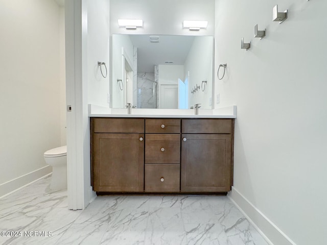 235 Weathersbee Dr, Hampstead, NC 28443 - full bath with baseboards, double vanity, marble finish floor, and toilet