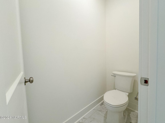 235 Weathersbee Dr, Hampstead, NC 28443 - bathroom with baseboards, marble finish floor, and toilet