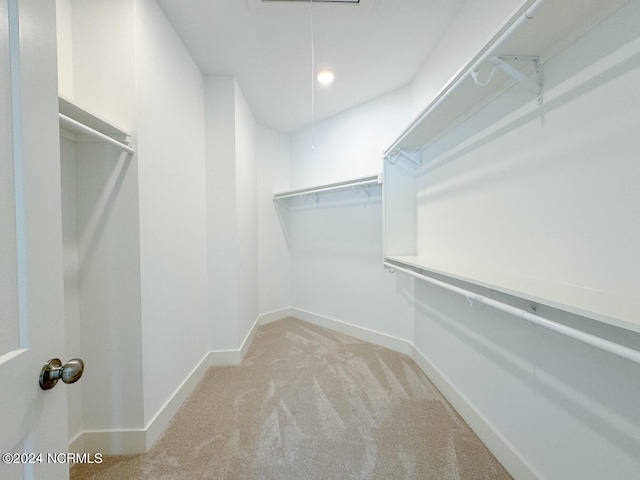 235 Weathersbee Dr, Hampstead, NC 28443 - spacious closet with attic access and carpet flooring