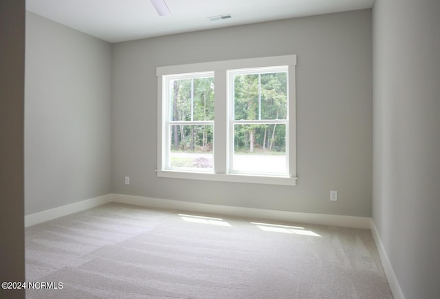 235 Weathersbee Dr, Hampstead, NC 28443 - carpeted empty room featuring a healthy amount of sunlight, baseboards, and visible vents