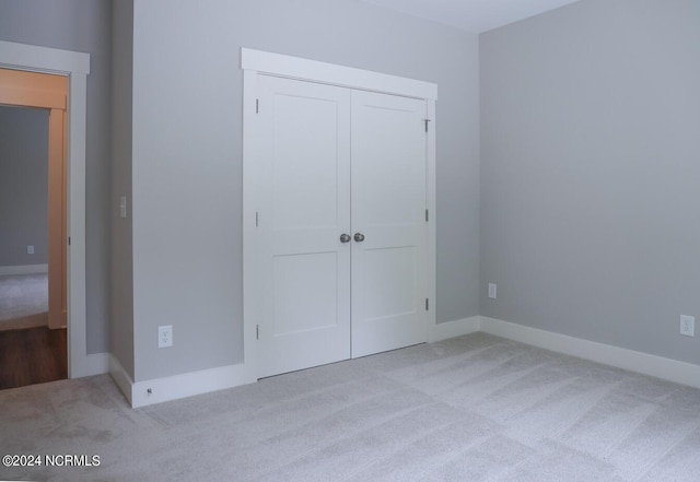 235 Weathersbee Dr, Hampstead, NC 28443 - unfurnished bedroom featuring carpet floors, baseboards, and a closet