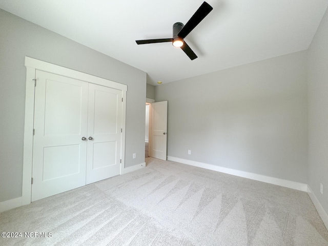 235 Weathersbee Dr, Hampstead, NC 28443 - unfurnished bedroom featuring baseboards, a closet, and light colored carpet