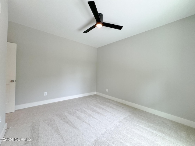 235 Weathersbee Dr, Hampstead, NC 28443 - unfurnished room with carpet floors, a ceiling fan, and baseboards