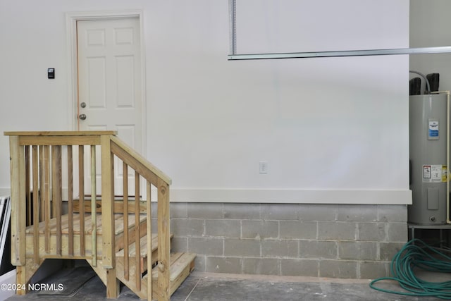 235 Weathersbee Dr, Hampstead, NC 28443 - stairway featuring concrete flooring and electric water heater
