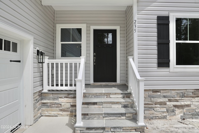 235 Weathersbee Dr, Hampstead, NC 28443 - entrance to property with covered porch and stone siding