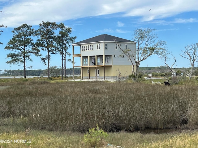 back of house featuring a water view