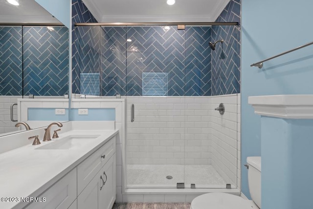 bathroom with crown molding, walk in shower, toilet, and vanity