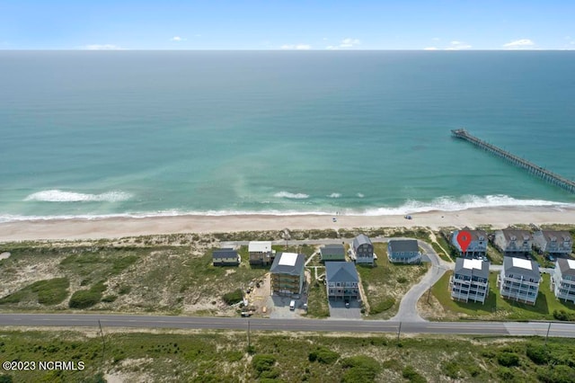 aerial view featuring a view of the beach and a water view