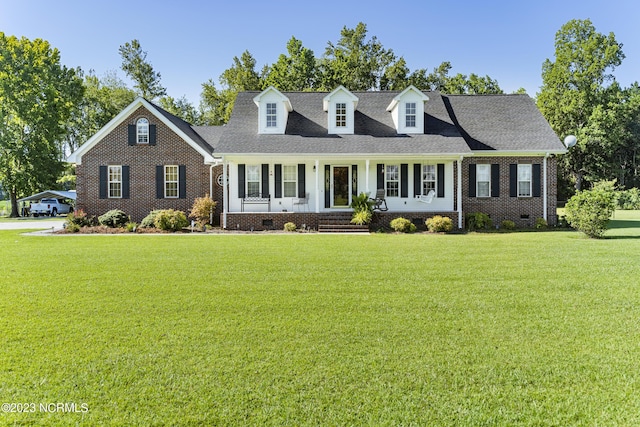 cape cod-style house with a porch and a front yard