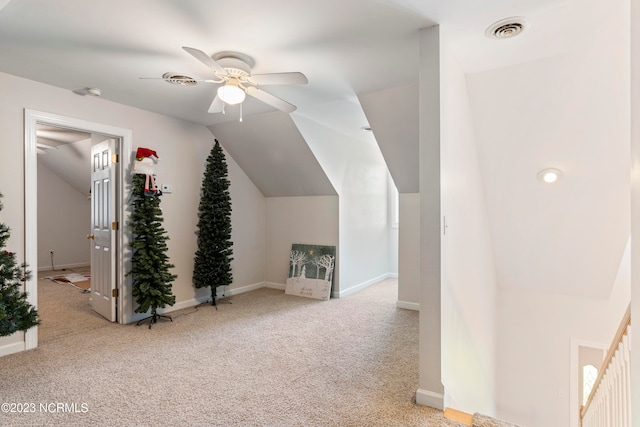 additional living space with light carpet, ceiling fan, and lofted ceiling