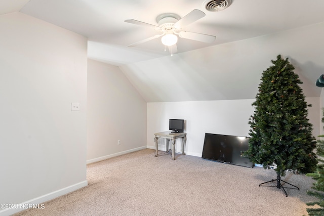 bonus room with ceiling fan, light carpet, and vaulted ceiling