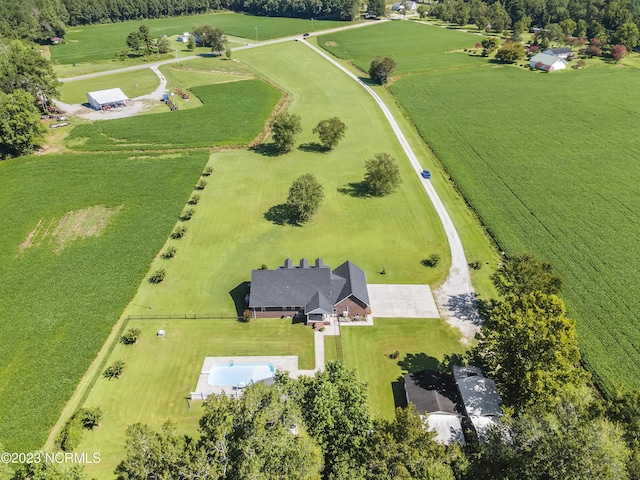 birds eye view of property with a rural view