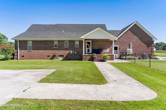 ranch-style house featuring central AC and a front lawn