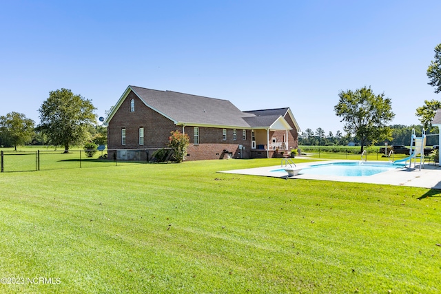 view of yard featuring a patio and a fenced in pool