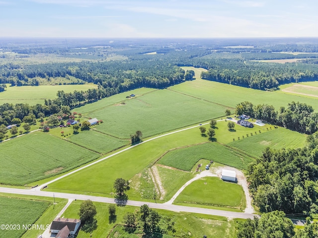 birds eye view of property with a rural view