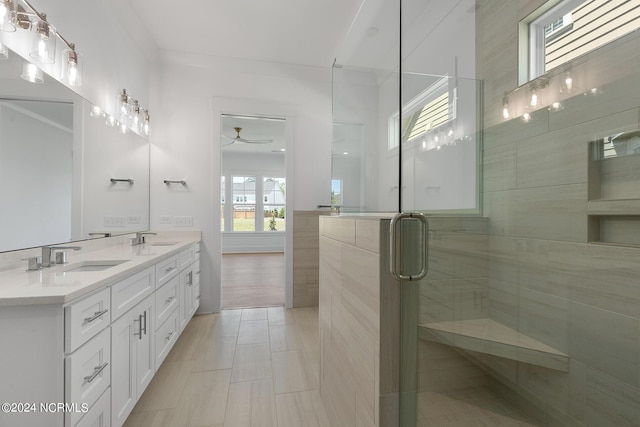 bathroom featuring vanity, an enclosed shower, and tile patterned floors