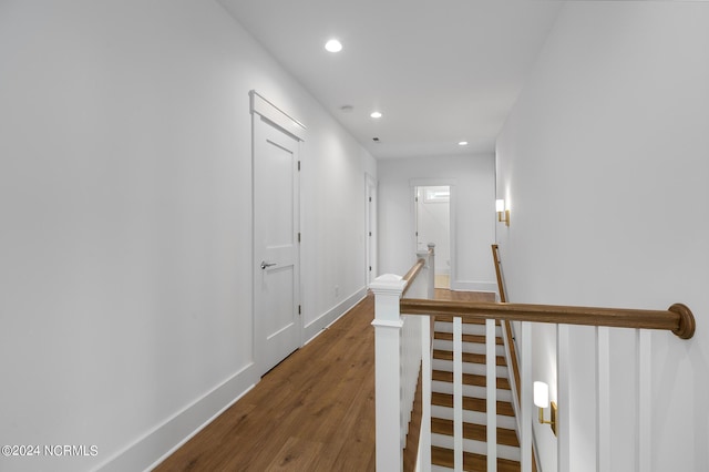 hall with hardwood / wood-style flooring