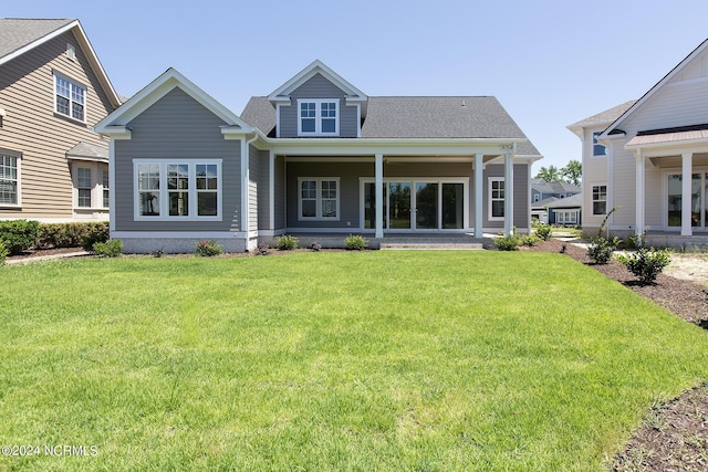 back of house featuring a yard