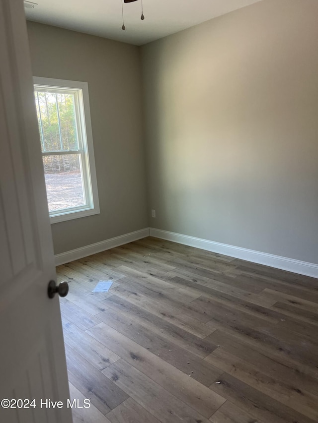 spare room featuring hardwood / wood-style floors