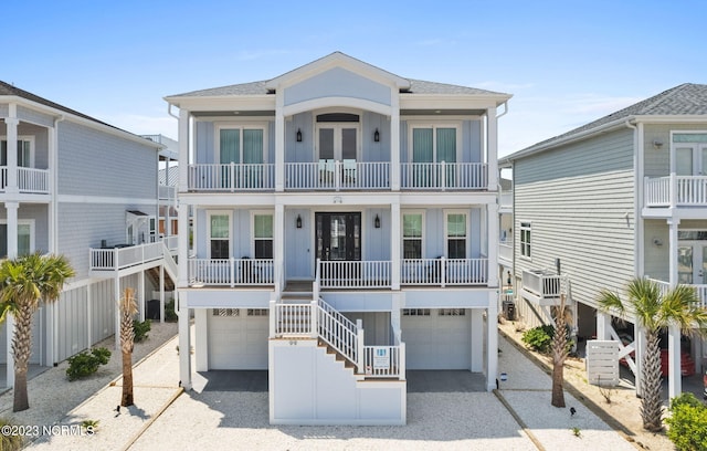 coastal home with a balcony and a garage