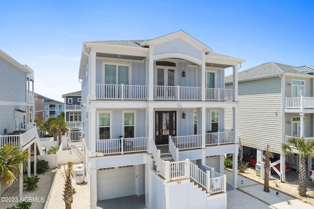 view of front of house with a balcony and a garage