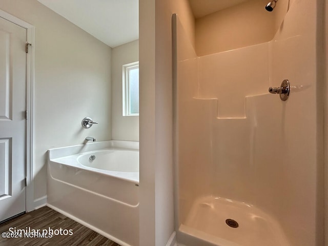 bathroom with separate shower and tub and hardwood / wood-style flooring