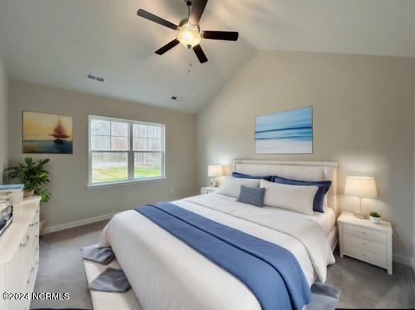 bedroom featuring ceiling fan, dark colored carpet, and lofted ceiling