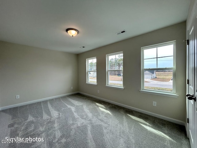 spare room featuring carpet floors