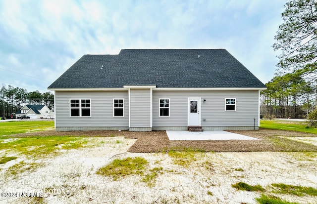 rear view of property featuring a patio