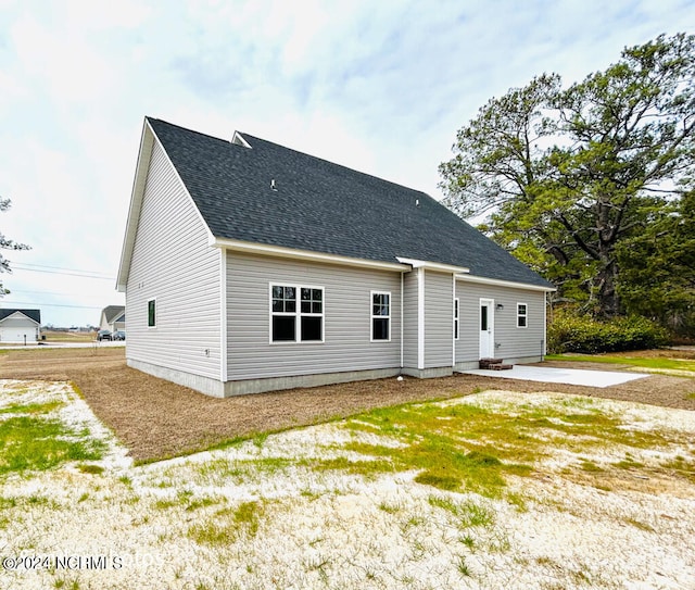 back of property with a patio area