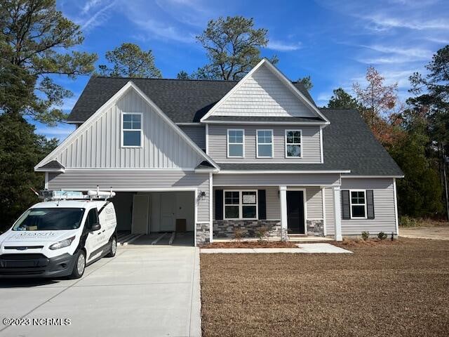 view of front of home with a carport