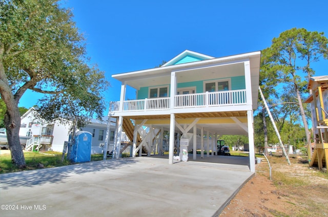 coastal home featuring a carport