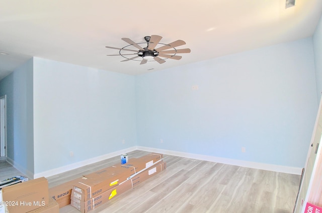 spare room featuring light hardwood / wood-style flooring and ceiling fan