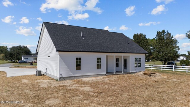 back of property featuring central AC unit