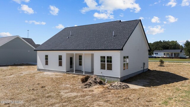 back of property with a patio area