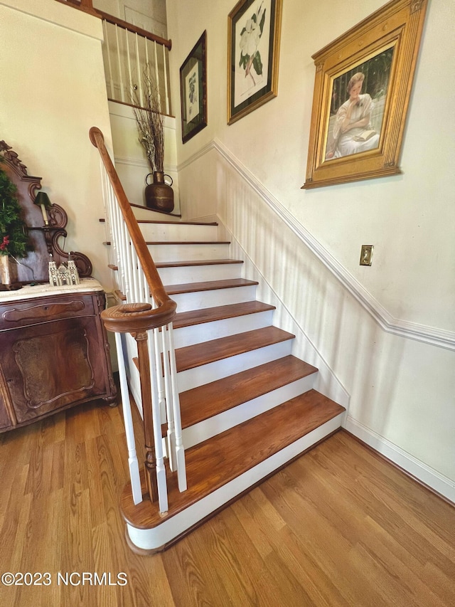 stairway featuring light hardwood / wood-style floors