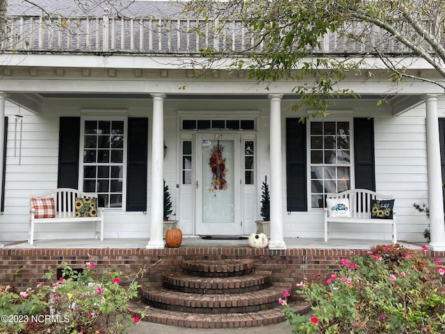 property entrance featuring covered porch