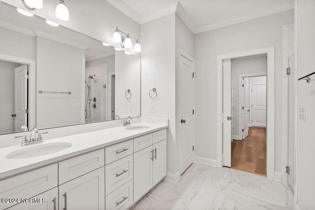 bathroom featuring crown molding, vanity, a shower with shower door, and wood-type flooring