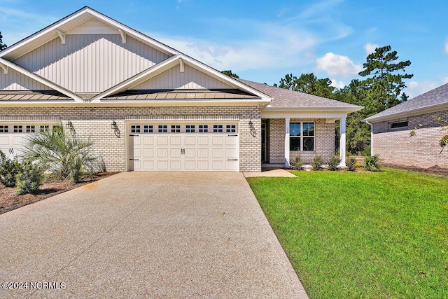 craftsman-style home with a garage and a front lawn