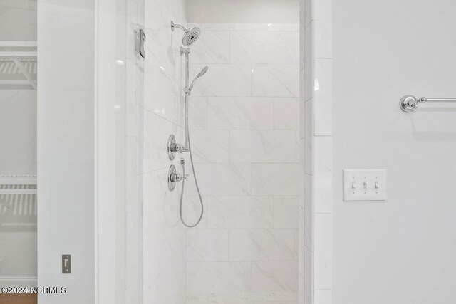 bathroom with tiled shower