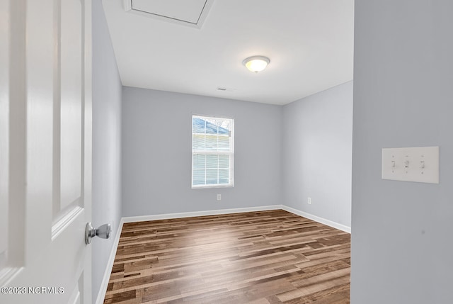 empty room with hardwood / wood-style floors