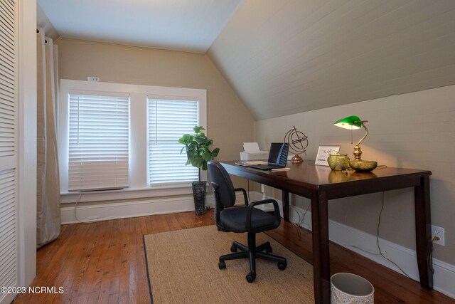 office with vaulted ceiling and hardwood / wood-style flooring