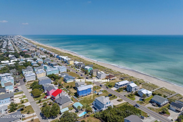 aerial view featuring a water view and a beach view