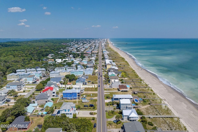 aerial view featuring a water view and a view of the beach