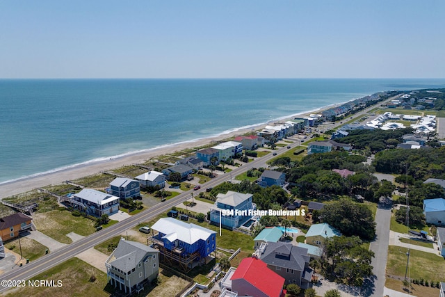 bird's eye view featuring a water view and a view of the beach