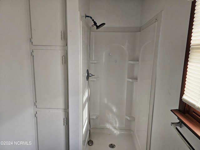 bathroom featuring walk in shower