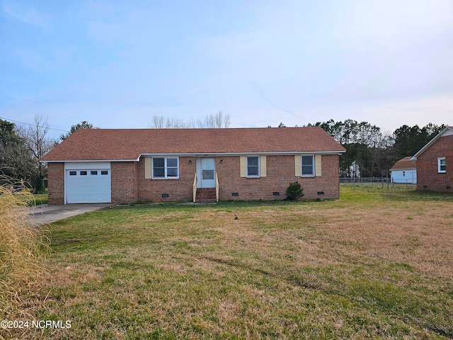 single story home with a front lawn and a garage