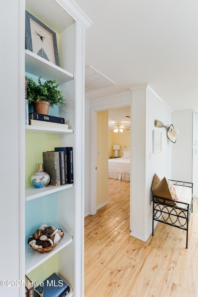 404 Mercer St, Oak Island, NC 28465 - corridor featuring wood finished floors and crown molding