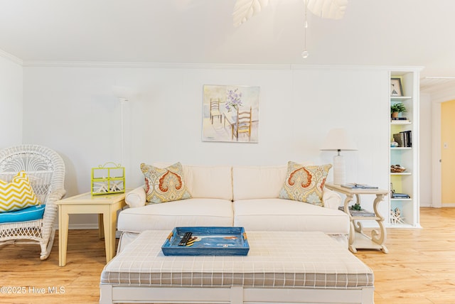 404 Mercer St, Oak Island, NC 28465 - living room with crown molding, light wood finished floors, and ceiling fan